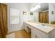 Bathroom featuring double sinks, granite counters, decorative mirror, window and tile flooring at 302 Cimarron Way, Lawrenceville, GA 30044