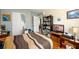 Bedroom with wood floors, light gray walls, a window and closet at 302 Cimarron Way, Lawrenceville, GA 30044