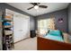 Cozy bedroom with neutral walls, a large window, and closet for storage at 302 Cimarron Way, Lawrenceville, GA 30044