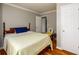 Bedroom with wood floors, light gray walls, and a large window at 302 Cimarron Way, Lawrenceville, GA 30044