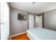 Bedroom with a TV, wood floor and two doors at 302 Cimarron Way, Lawrenceville, GA 30044