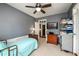 Bedroom with neutral carpet and walls, a TV, and a dresser on display at 302 Cimarron Way, Lawrenceville, GA 30044
