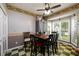 Eat-in kitchen area with table and chairs, featuring checkered floors and large windows at 302 Cimarron Way, Lawrenceville, GA 30044