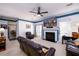 Cozy living room with a fireplace, TV, and comfortable seating arrangements at 302 Cimarron Way, Lawrenceville, GA 30044