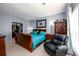 Spacious main bedroom featuring a walk-in closet, king-size bed, and sitting area at 302 Cimarron Way, Lawrenceville, GA 30044