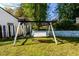 Backyard featuring a swing set on a grassy lawn at 302 Cimarron Way, Lawrenceville, GA 30044
