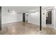 Finished basement with concrete floors, white walls, black support beams and an updated bathroom at 644 Wells Sw St # 8, Atlanta, GA 30310