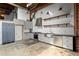 Modern kitchen features white cabinets, stainless steel appliances, and a large stainless steel sink at 644 Wells Sw St # 8, Atlanta, GA 30310