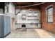 Spacious kitchen with stainless steel appliances, gray cabinets, and exposed brick at 644 Wells Sw St # 8, Atlanta, GA 30310
