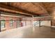 Loft area with exposed brick, wood ceilings, and railing at 644 Wells Sw St # 8, Atlanta, GA 30310