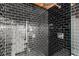 Modern shower with sleek black subway tile and polished chrome fixtures at 644 Wells Sw St # 8, Atlanta, GA 30310