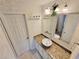 Granite countertop bathroom with decorative plants and a mirror at 6980 Roswell Rd # E1, Atlanta, GA 30328
