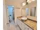 Bathroom vanity with granite countertop and bowl sink at 6980 Roswell Rd # E1, Atlanta, GA 30328