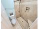Updated bathroom featuring a tiled shower and toilet at 6980 Roswell Rd # E1, Atlanta, GA 30328