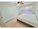 Clean bedroom with a ceiling fan and great natural light at 6980 Roswell Rd # E1, Atlanta, GA 30328
