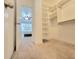 Carpeted walk-in closet with shelving, next to bedroom at 6980 Roswell Rd # E1, Atlanta, GA 30328
