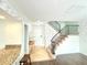 Welcoming entryway with staircase, leading to the upper level at 6980 Roswell Rd # E1, Atlanta, GA 30328