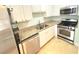Well-lit kitchen featuring stainless steel appliances and granite countertops at 6980 Roswell Rd # E1, Atlanta, GA 30328