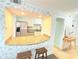 Open kitchen view highlighting granite countertops, white cabinets, and stainless appliances at 6980 Roswell Rd # E1, Atlanta, GA 30328