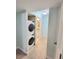 Modern laundry area offers a stacked washer and dryer at 6980 Roswell Rd # E1, Atlanta, GA 30328