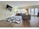 Bright living room featuring stylish wallpaper, a modern rug, and abundant natural light at 6980 Roswell Rd # E1, Atlanta, GA 30328