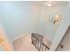 Carpeted staircase with black railing ascending to the next level at 6980 Roswell Rd # E1, Atlanta, GA 30328