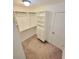 Bright walk-in closet offers shelving and storage solutions at 6980 Roswell Rd # E1, Atlanta, GA 30328