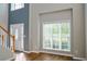 Inviting living room features a bright front door and large windows at 910 Lakeside Ct, Loganville, GA 30052