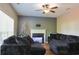 Comfortable living room featuring plush couches and a fireplace at 910 Lakeside Ct, Loganville, GA 30052