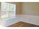 Stylish dining area features a window overlooking the landscaped backyard at 910 Lakeside Ct, Loganville, GA 30052