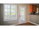 Bright kitchen windows and a glass door provide plenty of natural light at 910 Lakeside Ct, Loganville, GA 30052