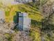 A high angle aerial view of the house shows its roof and how it sits in a large lot at 2850 Gant Quarters Dr, Marietta, GA 30068