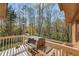Outdoor back deck with a gas grill and mature trees at 2850 Gant Quarters Dr, Marietta, GA 30068
