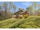 Large backyard with lush green grass and a multi-story brick home at 2850 Gant Quarters Dr, Marietta, GA 30068
