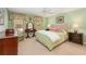 Cozy bedroom with carpet flooring, a tufted headboard, and light green walls at 2850 Gant Quarters Dr, Marietta, GA 30068