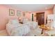 Pretty pink bedroom with twin beds, white metal frames, and vintage decor at 2850 Gant Quarters Dr, Marietta, GA 30068