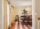 Formal dining room boasting a chandelier, wallpaper, shuttered windows and a striped rug at 2850 Gant Quarters Dr, Marietta, GA 30068