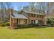 Beautifully landscaped brick home featuring a symmetrical design and a well-maintained lawn at 2850 Gant Quarters Dr, Marietta, GA 30068