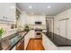 Bright kitchen with white cabinetry, granite countertops, stainless steel appliances, and hardwood floors at 2850 Gant Quarters Dr, Marietta, GA 30068
