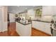 Bright kitchen featuring white cabinetry, granite countertops, stainless steel appliances, island, and hardwood floors at 2850 Gant Quarters Dr, Marietta, GA 30068