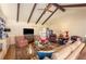 Living room with vaulted ceiling, exposed beams, fireplace, and hardwood floors at 2850 Gant Quarters Dr, Marietta, GA 30068