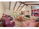 Living room with vaulted ceiling, exposed beams, fireplace, and natural light at 2850 Gant Quarters Dr, Marietta, GA 30068
