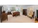 Spacious blue bedroom with a king bed, soft carpet, and vintage wooden furniture at 2850 Gant Quarters Dr, Marietta, GA 30068