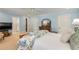 Relaxing blue main bedroom with carpeting, floral bedding and a view of the ensuite bathroom at 2850 Gant Quarters Dr, Marietta, GA 30068