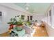 Bright sunroom with brick walls, parquet floors, and an abundance of plants at 2850 Gant Quarters Dr, Marietta, GA 30068