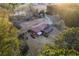 Overhead view of a home featuring a stone patio and beautiful surroundings with mature trees at 3856 Egypt Rd, Snellville, GA 30039