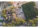 Overhead view of a home surrounded by mature trees, offering privacy and a peaceful setting at 3856 Egypt Rd, Snellville, GA 30039