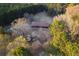 Birds eye view of a charming home surrounded by mature trees, offering a tranquil and secluded atmosphere at 3856 Egypt Rd, Snellville, GA 30039