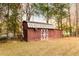 Rustic barn with white cross-buck doors at 3856 Egypt Rd, Snellville, GA 30039