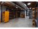 Spacious unfinished basement with concrete floor, exposed ductwork, and wooden shelving at 3856 Egypt Rd, Snellville, GA 30039